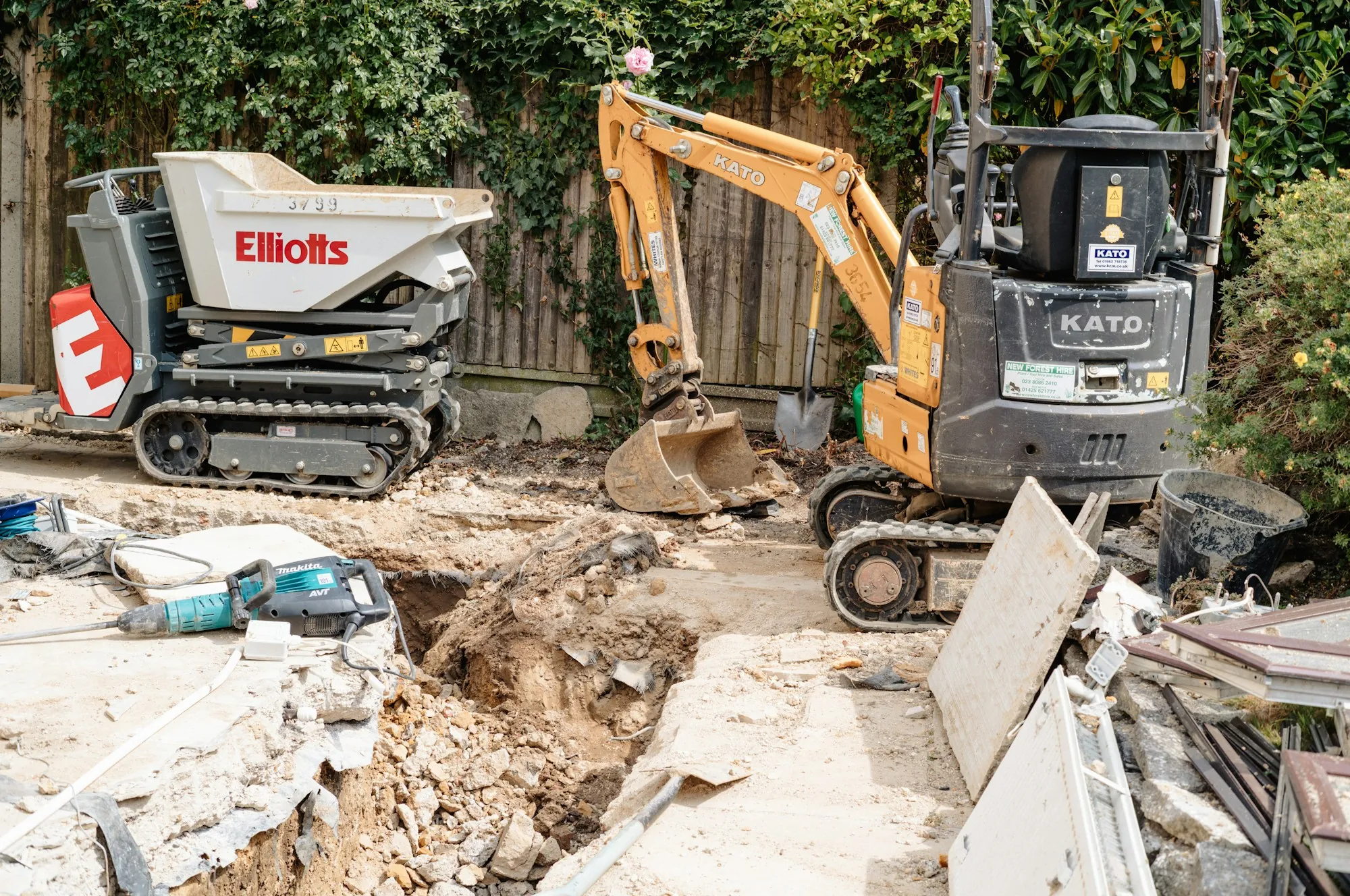 Mini excavator and dumper on a demolition site